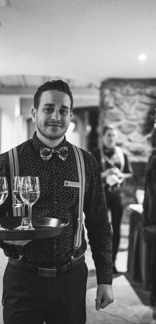110 Years Posthotel Historic picture of a waiter in 110 Years Posthotel