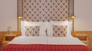 Double bed of the "Posthotel" Double Superior Room in Davos