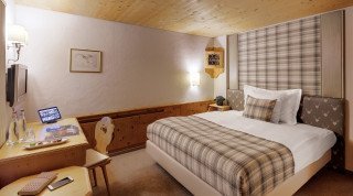 Comfortable bed of the Single Standard Room