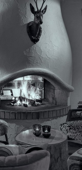 Lobby of the Morosani Hotel with an open fireplace