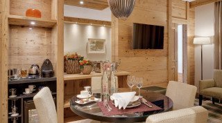 Living area with flatscreen at the "Schweizerhof" Suite in Davos