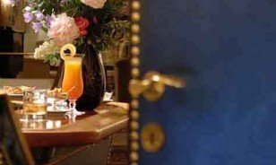 Blue door as the entrance to the Bolero Bar in Davos